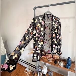 Sheer black blazer with colorful floral stitching